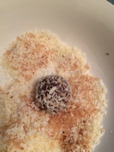 Little Hummingbird - Coating the bliss balls in desiccated coconut
